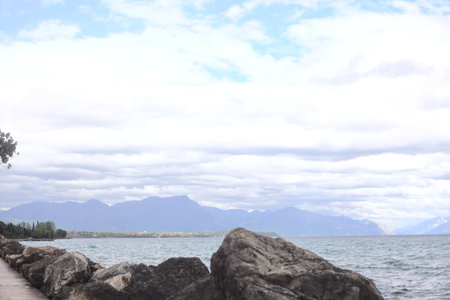 Promenade bordered by a breakwater on a cloudy day by the lakeshore