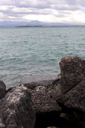 Breakwater on a cloudy day by the lakesideの写真素材