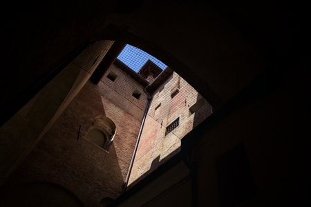 Opening between parts of a palace with a clear sky aboveの写真素材