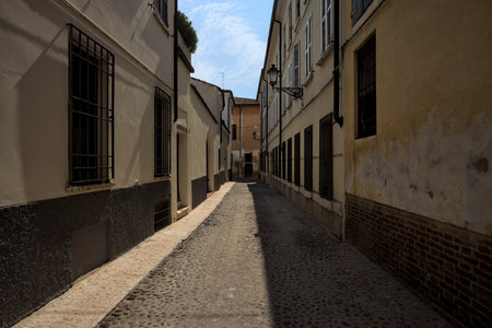 Street half in the shade on a sunny day