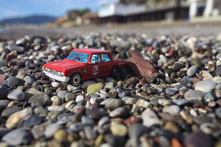 Cavi di Lavagna- 6TH NOVEMBER 2025 - Hot Wheels replica of a Alfa Romeo Giulia Ti Sprint on a beach under a cold sun pointing to the horizonのeditorial素材