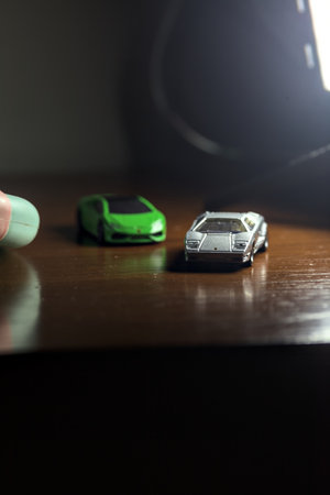 Genoa, Italy - 20TH NOVEMBER 2025 - Replicas of a gray Lamborghini Countach in front of a green...