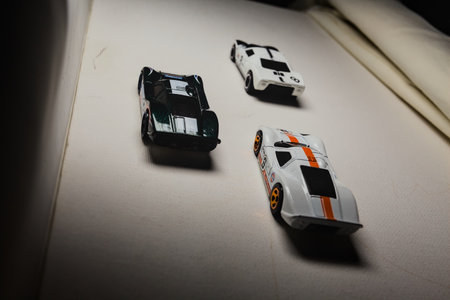 Mantua, Italy - 28TH DECEMBER 2025 - Hot Wheels replicas of two Ford GT40 Mark IV, one in a green...