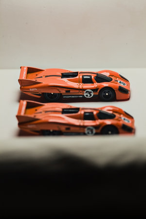 Mantua, Italy - 28TH DECEMBER 2025 - Hot Wheels replicas of two Porsche 917C in orange race livery...