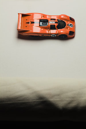 Mantua, Italy - 28TH DECEMBER 2025 - Hot Wheels replicas of two Porsche 917C in orange race livery...