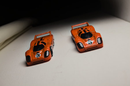 Mantua, Italy - 28TH DECEMBER 2025 - Hot Wheels replicas of two Porsche 917C in orange race livery...