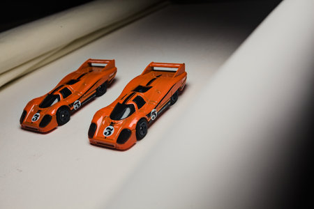 Mantua, Italy - 28TH DECEMBER 2025 - Hot Wheels replicas of two Porsche 917C in orange race livery...