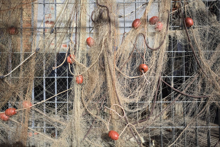 Fishing net hanging on a fence seen up close