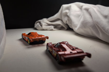 Mantua, Italy - 4TH JANUARY 2025 - Hot Wheels replicas of two Mazda 787B in race livery on white...