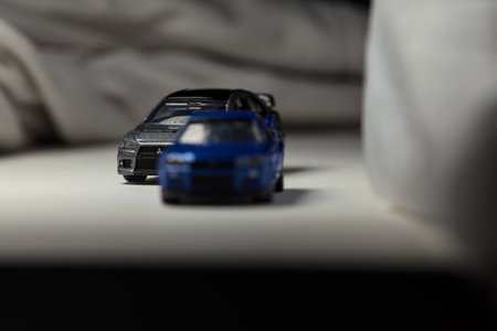 Mantua, Italy - 4TH JANUARY 2025 - Takara Tomy replicas of a Nissan Skyline GT-R V-Spec Nur II and a...
