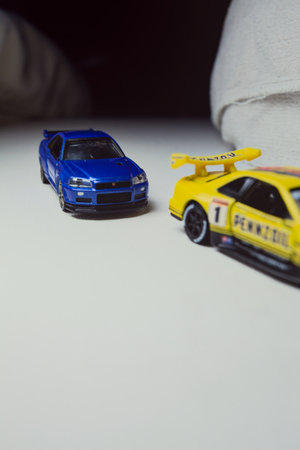 Mantua, Italy - 10TH JANUARY 2025 - Takara Tomy replicas of a Nissan Skyline GT-R V-Spec II Nur and...