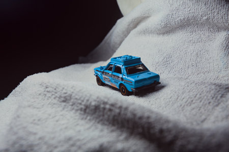 Mantua, Italy - 10TH JANUARY 2025 - Matchbox replica of a 1970 Datsun 510 in rally livery and trim...
