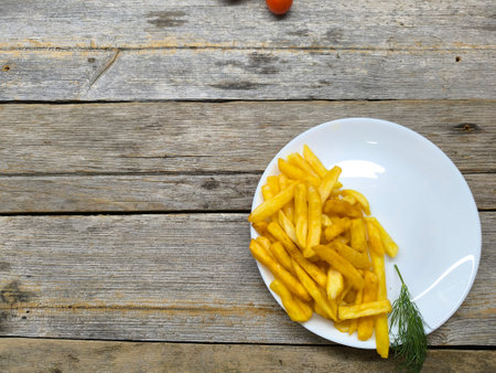 Close-up with French fries and delicious sausage. high quality photos.の写真素材