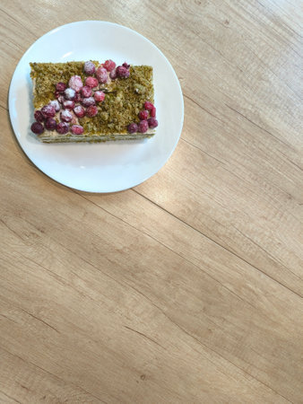 Pieces of cottage cheese sponge cake with cranberries on a plate. Top view of the Photo in high qualityの写真素材
