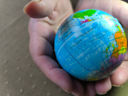 Hands holding the globe. The concept of human concern for the well-being of the planet.