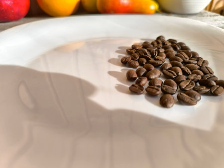 white plate with roasted coffee beans.の写真素材