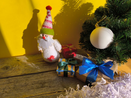 festive beautiful toy Santa Claus near the Christmas tree.の写真素材