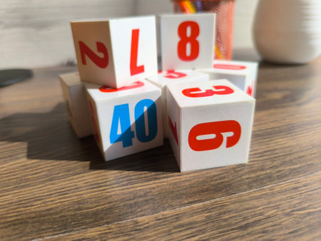 Cubes with numbers on a wooden table