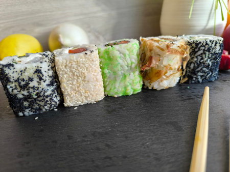Delicious sushi rolls on a chopping board.の写真素材