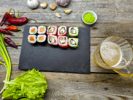 sushi on a granite board on a wooden table backgroundの写真素材