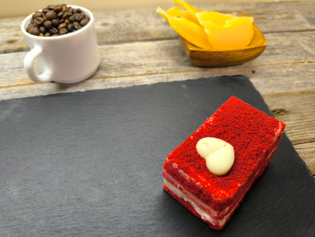 tender juicy red cake lies on a granite boardの写真素材