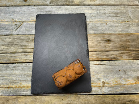 tiramisu lies on a granite boardの写真素材