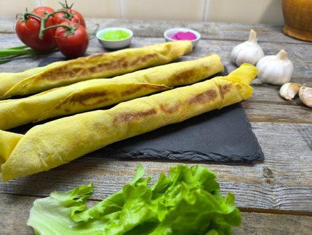 Juicy pieces of cheese shawarma on a sliced ââgranite boardの写真素材