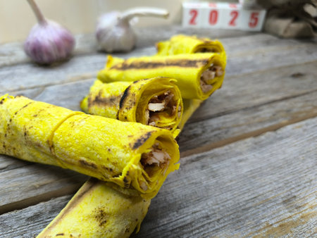 delicious cheese shawarma lies on a wooden tableの写真素材