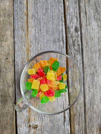 transparent cup filled with candied fruitsの写真素材