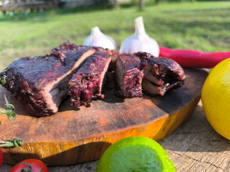 juicy steak on a chopping board surrounded by vegetables and fruits. High quality photoの写真素材
