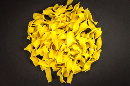 Egg pasta Pappardelle close up backgroundの写真素材