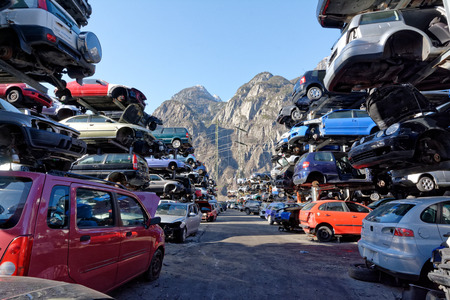 Valais, Switzerland, 21.02.2019, Recycling of old,used, wrecked cars. Dismantling for parts at scrap...