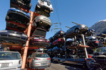 Valais, Switzerland, 21.02.2019, Recycling of old,used, wrecked cars. Dismantling for parts at scrap yards and sending for remeltingのeditorial素材