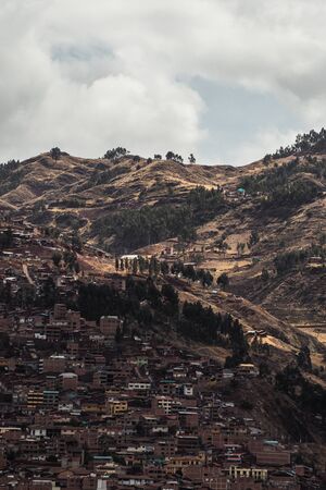 view of the city of Cusco between the mountainsの写真素材