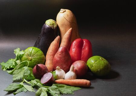 Various healthy and organic vegetables on black backgroundの写真素材