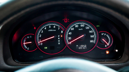 The bright photo of the dashboard in the car with black salon