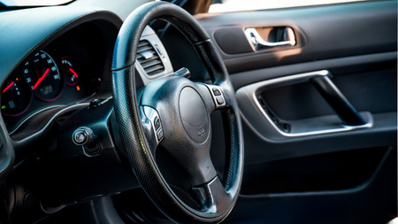 The bright photo of the dashboard in the car with black salonの写真素材
