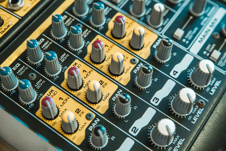 Photo of the analog mixer of the sound producer close upの写真素材