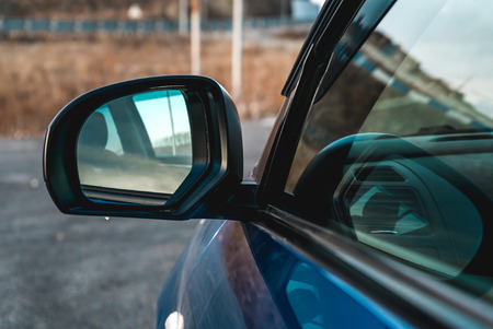 Photo of side automobile mirror of blue color close upの写真素材