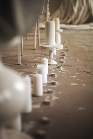 The photo decorative the candles standing on a floor one after anotherの写真素材