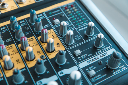 Photo of the analog audio mixer of the sound producer close upの写真素材