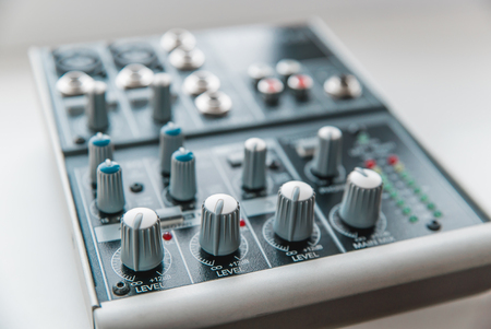 Photo of the analog audio mixer of the sound producer close upの写真素材