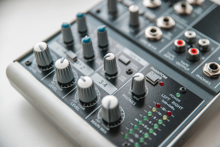 Photo of the analog audio mixer of the sound producer close upの写真素材