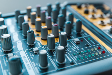 Photo of the analog audio mixer of the sound producer close upの写真素材