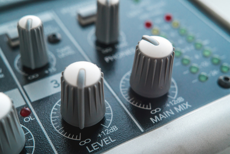 Photo of the analog audio mixer of the sound producer close upの写真素材