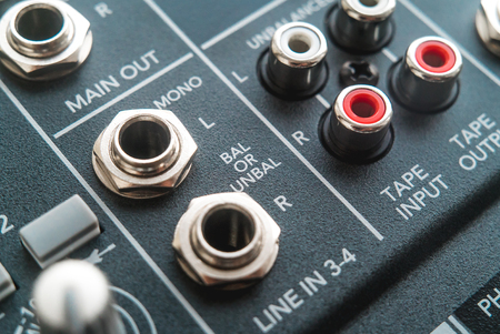 Photo of the analog audio mixer of the sound producer close upの写真素材