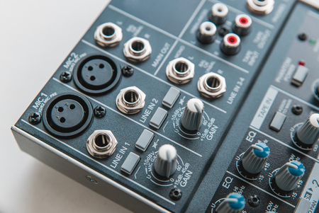 Photo of the analog audio mixer of the sound producer close upの写真素材