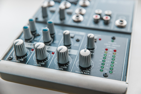 Photo of the analog audio mixer of the sound producer close upの写真素材