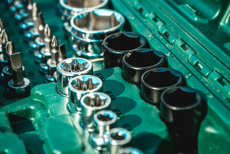 The photo of set of istrument in a green caseの写真素材