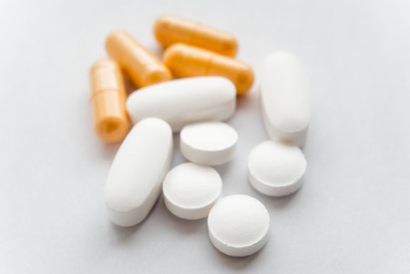 The photo of several tablets on a white background close up